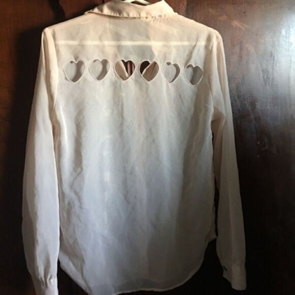 Pale pink button down heart cutout blouse by TRAMP